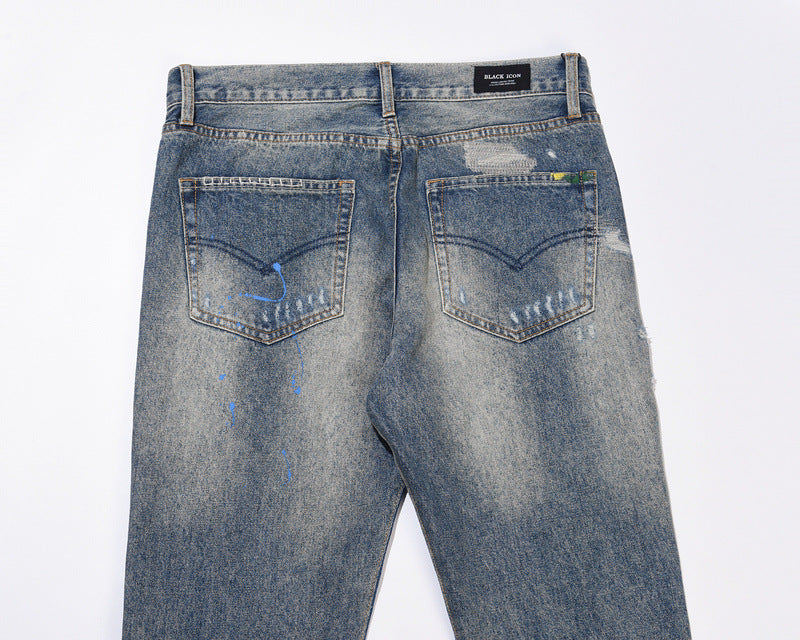 Jeans Flare Azzurro con Schizzi di Vernice