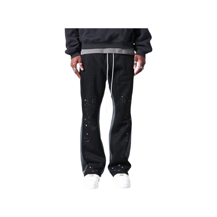 Pantaloni in Tuta Nera Flare di Cotone con schizzi di Vernice Uomo2