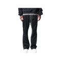 Pantaloni in Tuta Nera Flare di Cotone con schizzi di Vernice Uomo2