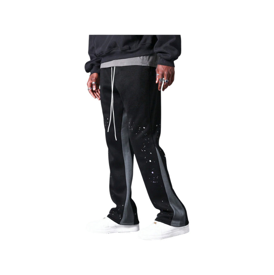 Pantaloni in Tuta Nera Flare di Cotone con schizzi di Vernice Uomo