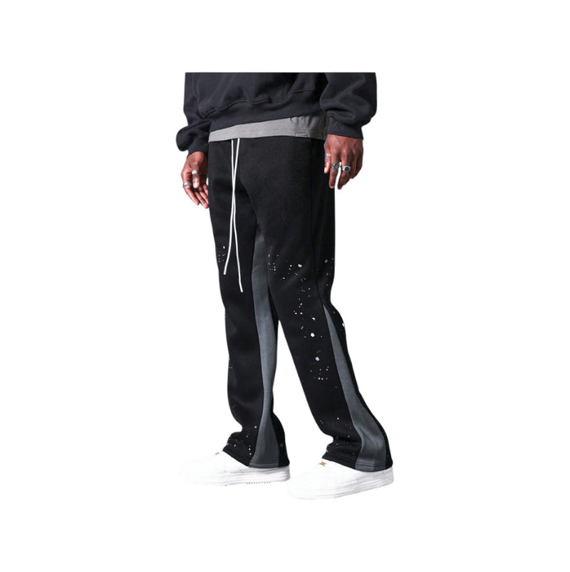 Pantaloni in Tuta Nera Flare di Cotone con schizzi di Vernice Uomo